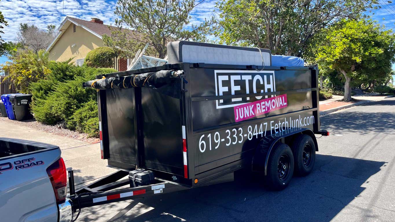 mattress in a black dump trailer